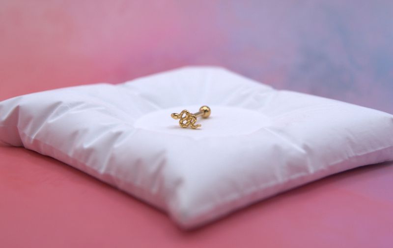 Golden Snake piercing
