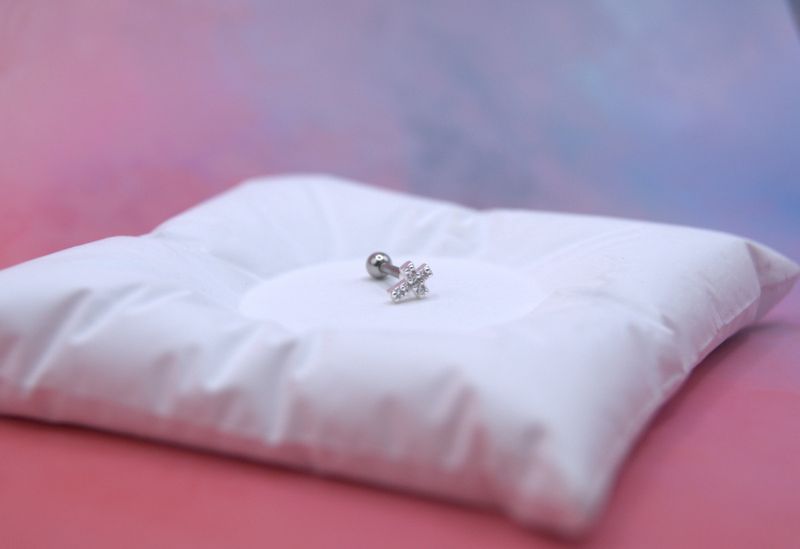 Silver Cross piercing